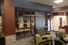 This is a new construction use of Belbien architectural film.  This was a new hospital auxiliary building in western North Carolina. All wood walls, cabinets, ceiling clouds, columns, and cabinets were constructed out of black melamine. Belbien architectural film was then applied to give it its final look.