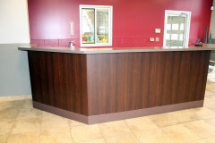 Altyno film installation on cabinets and reception desk at retail automotive center in the Raleigh-Durham area (after photo).